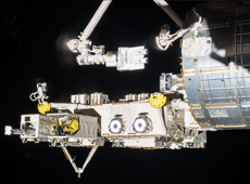 Small satellites being moved from Kibo to space by Kibo’s robotic arm (courtesy of JAXA/NASA)