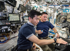 Astronaut Yui (left) training on the ISS for the docking of KOUNOTORI5  (courtesy of JAXA/NASA)