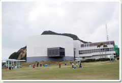 The Space Museum, with children playing in the park in front of the building
