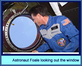 Astronaut Foale looking out the window
