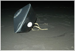 Sample return capsule containing comet dust, after landing in the Utah desert(Courtesy of NASA)