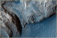 Mars Reconnaissance Orbiter found possible evidence of a liquid that once flowed. Part of crater in Meridiani Planum (Courtesy of NASA/JPL-Caltech/University of Arizona)