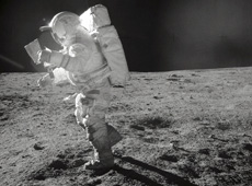 Apollo 14 Astronaut walking on the Moon (Courtesy of NASA)