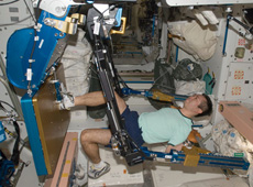 Astronaut Wakata exercising using the Advanced Resistive Exercise Device (ARED) (Courtesy of NASA)