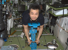 Astronaut Wakata weighing himself (Courtesy of NASA)
