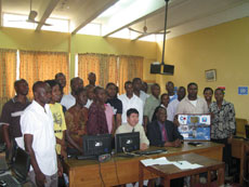 Commemorative photo with students at the Regional Center in Nigeria. A JAXA Kibo panel was presented as a gift. (Photo by UN Outer Space Affairs)
