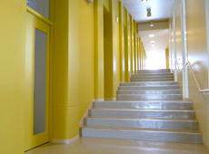 Offices are lined up in a spiral, and the doors are placed on the stair landings.