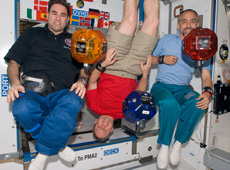 Richard Garriott (right) and the microsatellite SPHERES (Courtesy of NASA)