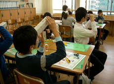 Children make cameras in class at Kudan Cosmic