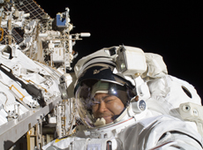 Astronaut Akihiko Hoshide conducting a spacewalk (courtesy: JAXA/NASA)