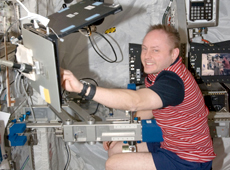 Astronaut Fincke working on the European Columbus Laboratory (Courtesy of NASA)