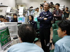 Prof. Kawaguchi and his colleagues in the control room, watching the return of HAYABUSA