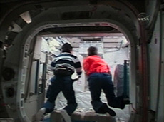 Astronaut Takao Doi (left): the first person to enter the ELM-PS (courtesy: NASA)