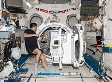 Astronaut Wakata preparing for deployment of small satellites (courtesy: JAXA/NASA)
