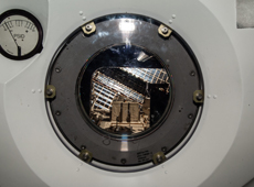 J-SSOD system inside Kibo’s airlock. The outside hatch of the airlock is open, and the satellite case is being transferred into the space environment. (courtesy: JAXA/NASA)