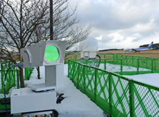 Weather observation sensors for LOTAS installed at Shonai Airport in Yamagata (lidar in the foreground and radar in the background)