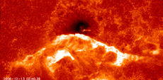 Flare ribbon moving into a sunspot
