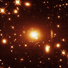 A huge galaxy at the center of the galaxy cluster PKS 0745-191, captured by the Hubble Space Telescope. (courtesy: NASA/STScl/Fabian, et al.)
