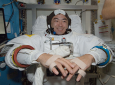 Astronaut Hoshide preparing for an EVA (courtesy: JAXA/NASA)