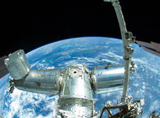 Picture taken during the EVA. KIBO is seen on the left. (courtesy: JAXA/NASA)