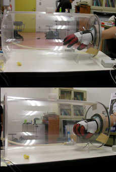 The mobility of a spacesuit glove is verified by placing a hand with a stretch glove in a low-pressure chamber. 