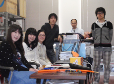 Prof. Tanaka with students in his lab.