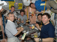 ISS Expedition 20 crew having a meal (Courtesy of NASA)