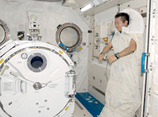 Astronaut Wakata in a sleeping bag in Kibo (Courtesy of NASA)