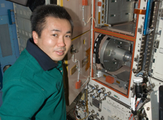Astronaut Wakata working on the Cell Biology Experiment Facility (CBEF) in Kibo (Courtesy of NASA)