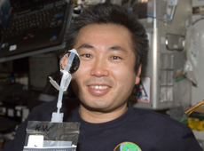 Astronaut Wakata with water recycled on the ISS (Courtesy of NASA)