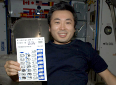 Astronaut Koichi Wakata holding a bisphosphonate agent (Courtesy: NASA/JAXA)