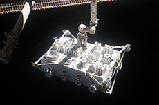 The ISS robotic arm, controlled by Wakata, grasping the extravehicular experiment platform (courtesy: NASA)